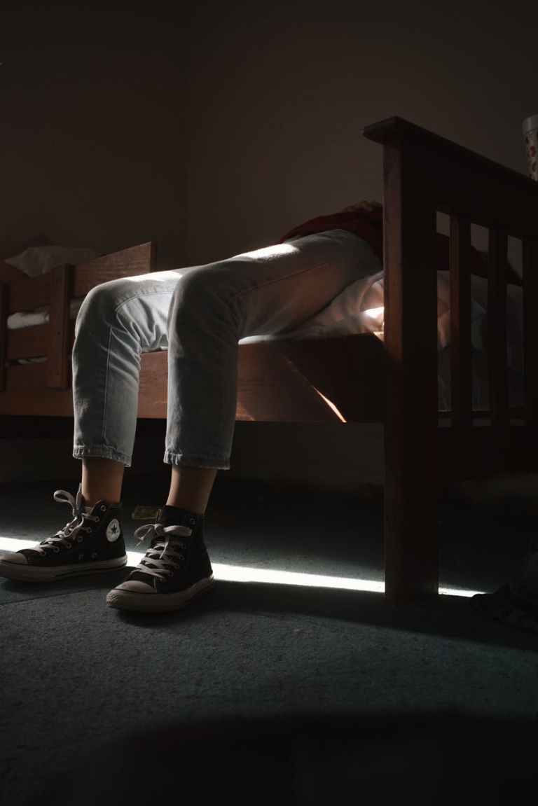 pair of black and white converse all star and gray denim jeans